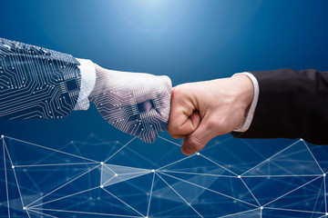 two businesspeople making fist bump