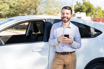 Happy Mid Adult Man Standing Next To His Car