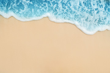 Background of Soft Blue Ocean Wave On Sandy Tropical Beach.