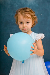 Wall Mural - GIRL IN BLUE DRESS WITH BLUE BALL