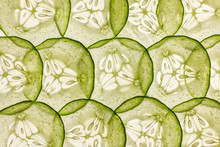 Very Thin Slices Of Fresh Cucumber On White Background