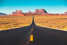 Long Road In Monument Valley At Sunset, USA