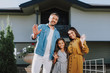 © Yakobchuk Olena - Happy family is locating near their home