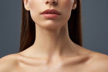 young woman with beautiful full lips and graceful neck