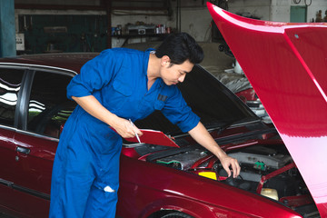 mechanic check car in his garage