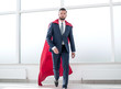 © ASDF - Businessman in a red superhero cloak.