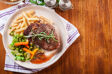 Wall Mural - Beef steak served with baked potatoes