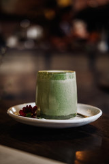 Wall Mural - Matcha latte art with vegan coconut milk in glass. Copyspace, image toned filter