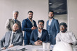 © alfa27 - Formal meeting of several multi-ethnic male colleagues gathered in executive s office to discuss new ideas