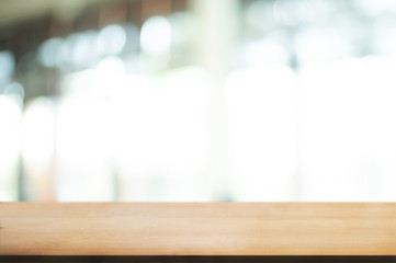 empty wood table with blur montage restaurant background