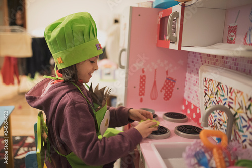 Cuadros en Lienzo little girl plays in toy kitchen