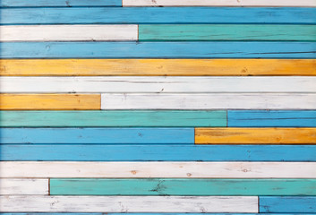 Wall Mural - Surface of the old boards painted in white, yellow and blue