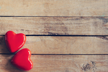 Wall Mural - two red heart on wood table background with copy space