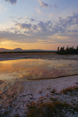 Wall Mural - Sunset fumes over the Grand Prismatic pool in Yellowstone National Park, United States