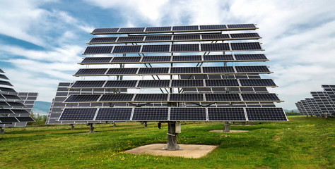 Solar panels, photovoltaics, with sun tracking systems -  alternative electricity source, concept of sustainable resources