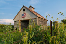 Rustic Barn With American Flag