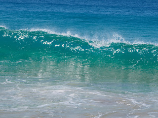 beautiful turquoise wave in the atlantic ocean.