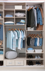 Wall Mural - Stylish clothes, shoes and home stuff in large wardrobe closet