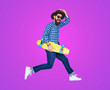 © kegfire - Hipster with beard in motion on purple background
