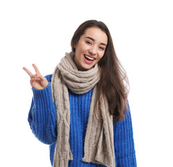 Sticker - Young woman wearing warm clothes on white background. Winter season