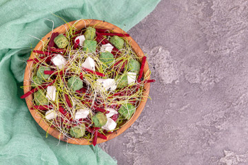 Wall Mural - Unusual salad with beetroot, feta cheese, leek sprouts and sesame