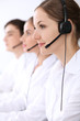 © rogerphoto - Call center. Focus on beautiful woman in headset