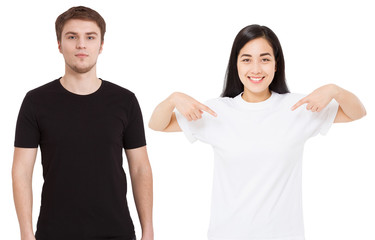 Wall Mural - Asian girl and man in blank template t shirt isolated on white background. Guy and young woman in tshirt with copy space and mock up for advertising. White and black shirts. Front view