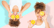 Summer time holidays. Beautiful young african american women with orange fruit food collage isolated . Afro girl and diet concept. Copy space. Mock up. Skin care, Afro curly hair style