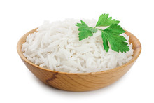 Rice In A Wooden Bowl Isolated On White Background. Top View. Flat Lay