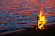 Fire on the beach at sunset