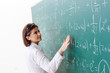 © Elnur - Female math teacher in front of the chalkboard