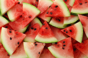 Slices of ripe watermelon as background, closeup