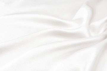 The texture of the satin fabric of white color for the background