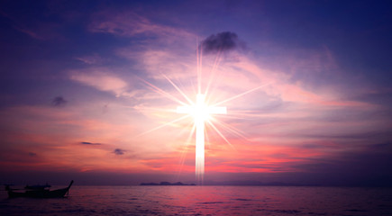 Wall Mural - concept of jesus christ: white cross on sunset sky background