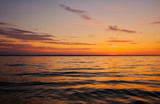 Fototapeta Natura - Beautiful fiery sunset sky on the beach. Composition of nature