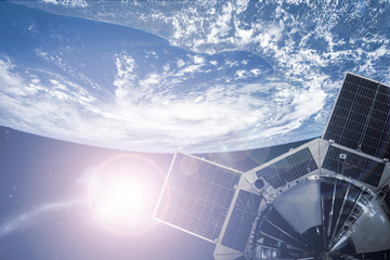 Wall Mural - space satellite in outer space orbiting the earth. elements of this image furnished by nasa а