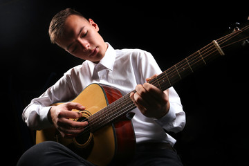 Wall Mural - Young men playing the guitar