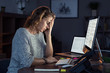 © Rido - Stressed woman working over time at night