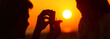 © Antonioguillem - Banner of silhouette of marriage proposal at sunset