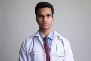 Wall Mural - Portrait of young Indian man doctor wearing eyeglasses