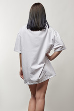 Back View Of Young Woman In White Oversize T-shirt With Copy Space Isolated On Grey