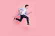 © deagreez - Full length side profile body size photo of jumping high he his him handsome run fast  look empty space need win victory winner wearing casual jeans checkered plaid shirt isolated on rose background