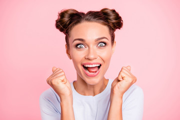 Close-up portrait of her she nice-looking crazy lovely attractive cheerful cheery glad funny girl with buns holding fists opened mouth isolated over pink pastel background