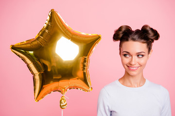 Wall Mural - Close-up portrait of nice cute adorable attractive lovely sweet cheerful positive girl looking at big large air baloon golden star isolated over pastel pink background