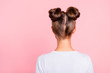 © deagreez - Rear back behind view of nice attractive groomed girl wearing two fashionable buns isolated over pink pastel background