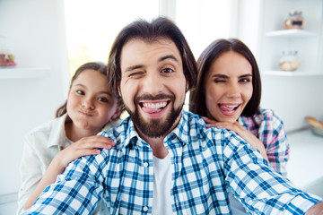 Sticker - Self-portrait of nice cute sweet lovely attractive trendy cheerful cheery childish positive people mom dad rejoicing spending time having fun in light white modern interior indoors