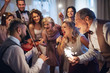 © Halfpoint - A young bride, groom and other guests dancing and singing on a wedding reception.