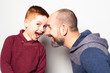 © Louis-Paul Photo - cheerful redhead father and son and smiling at camera isolated on white