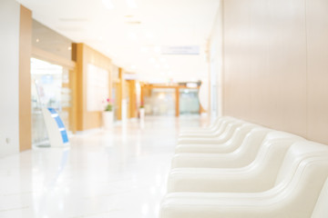 Sofa in waiting area of luxury hospital. Clinic corridor interior background. Healthcare and medical concept