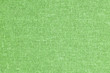 Green fashion background. Closeup, detailed fiber canvas pattern backdrop.